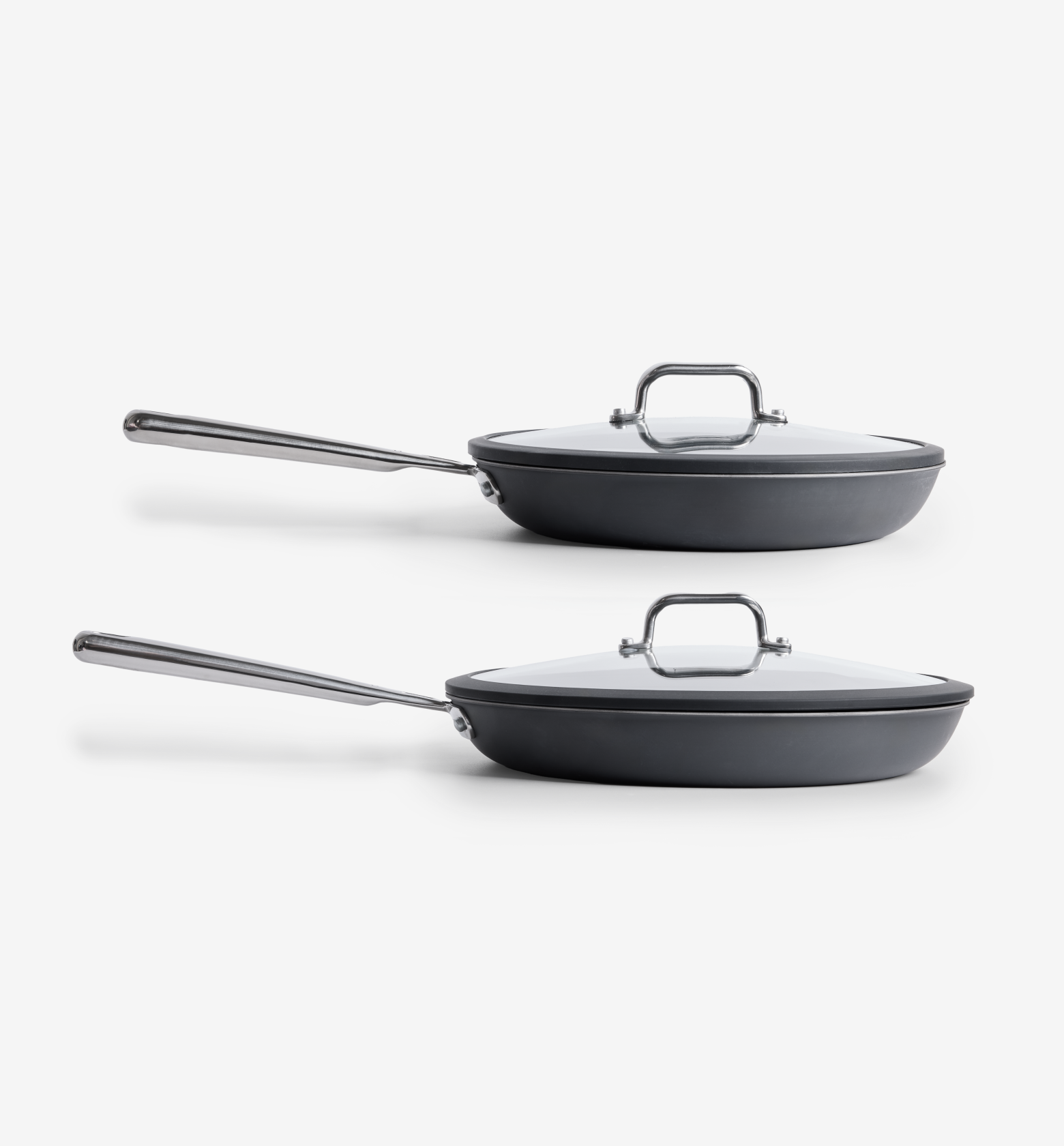 Hard-anodized nonstick frying pans set with glass lids and stainless steel handles
